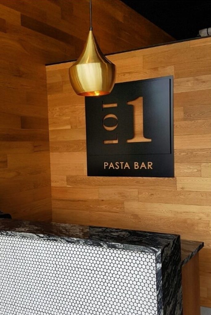White oak feature wall at a restaurant entry
